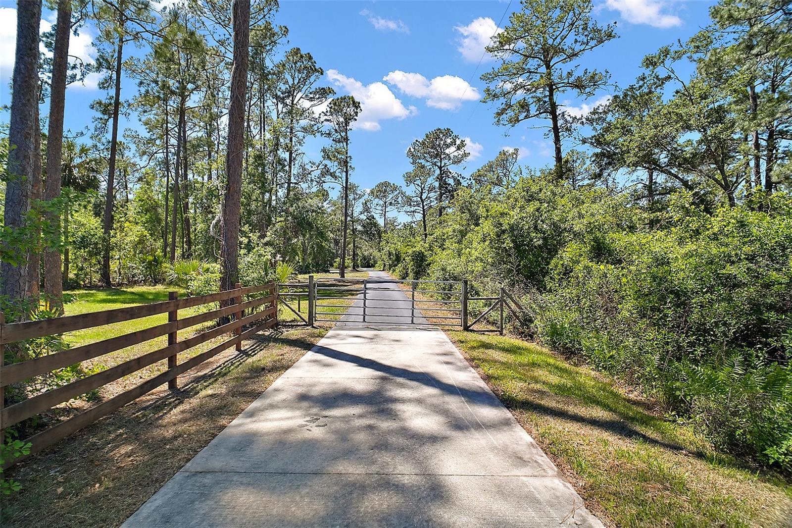 Gated driveway entrance at 40325 Emeralda Island Road Leesburg FL